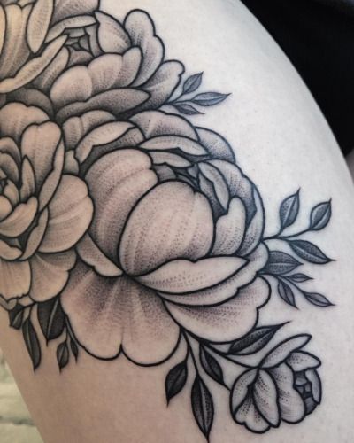 a woman's thigh with flowers on it and the words peony tattoos / tumbi pinteres