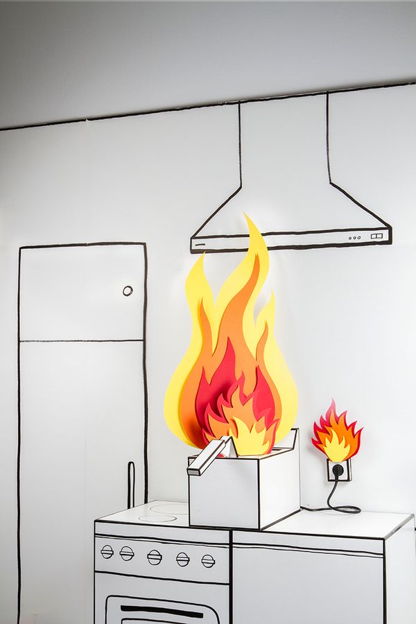 a drawing of a stove on fire in a kitchen