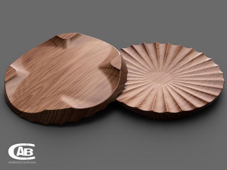 two wooden plates sitting on top of each other