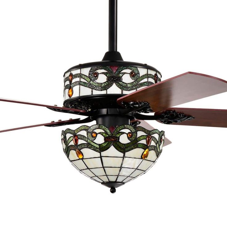 a ceiling fan with stained glass shades on it