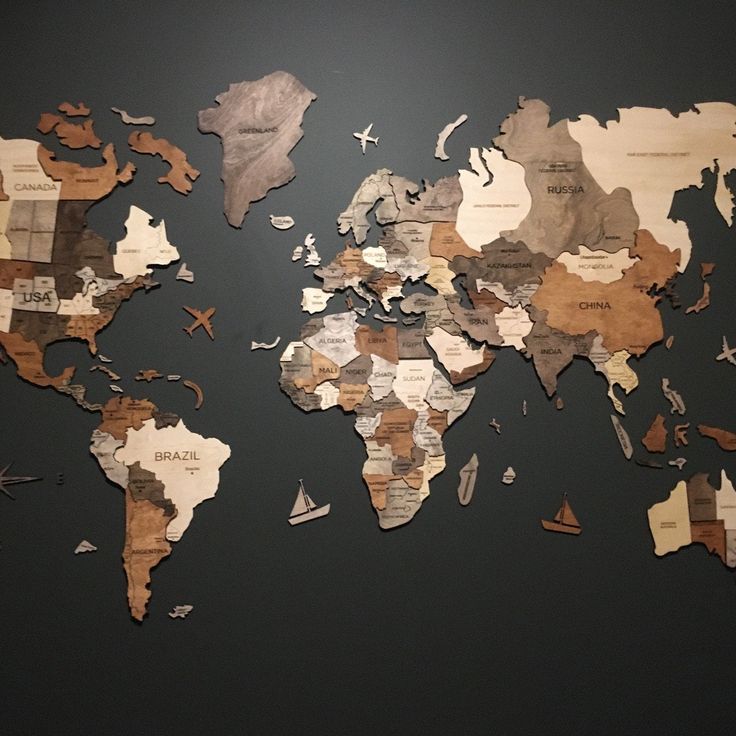 the map of the world is made up of different types of pieces of wood and paper