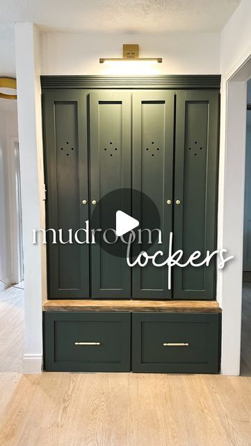 an empty room with green cupboards and wood flooring in front of the door