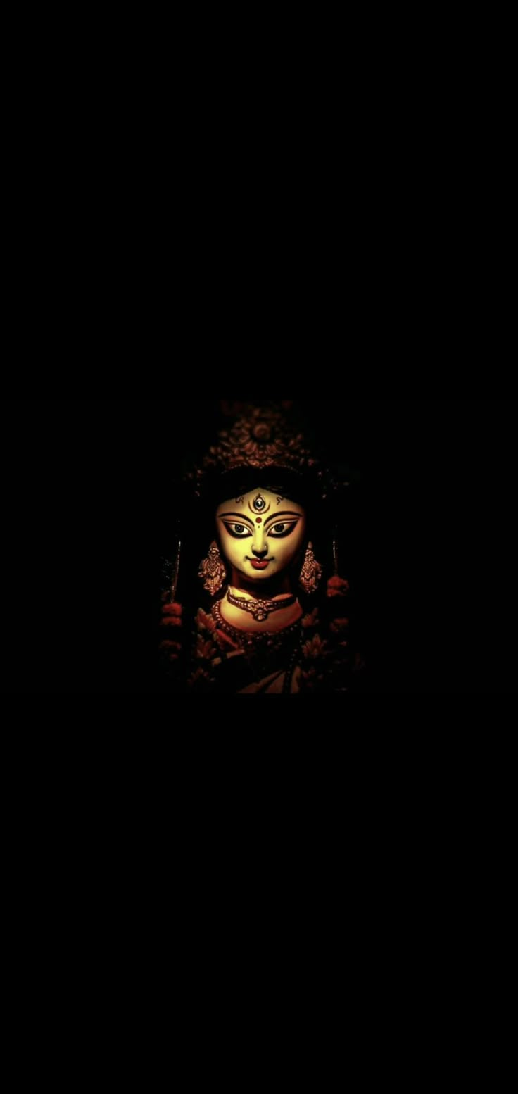 an image of a buddha statue in the dark