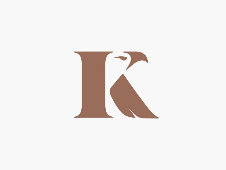 the letter k with an eagle on it's head is shown in brown and white