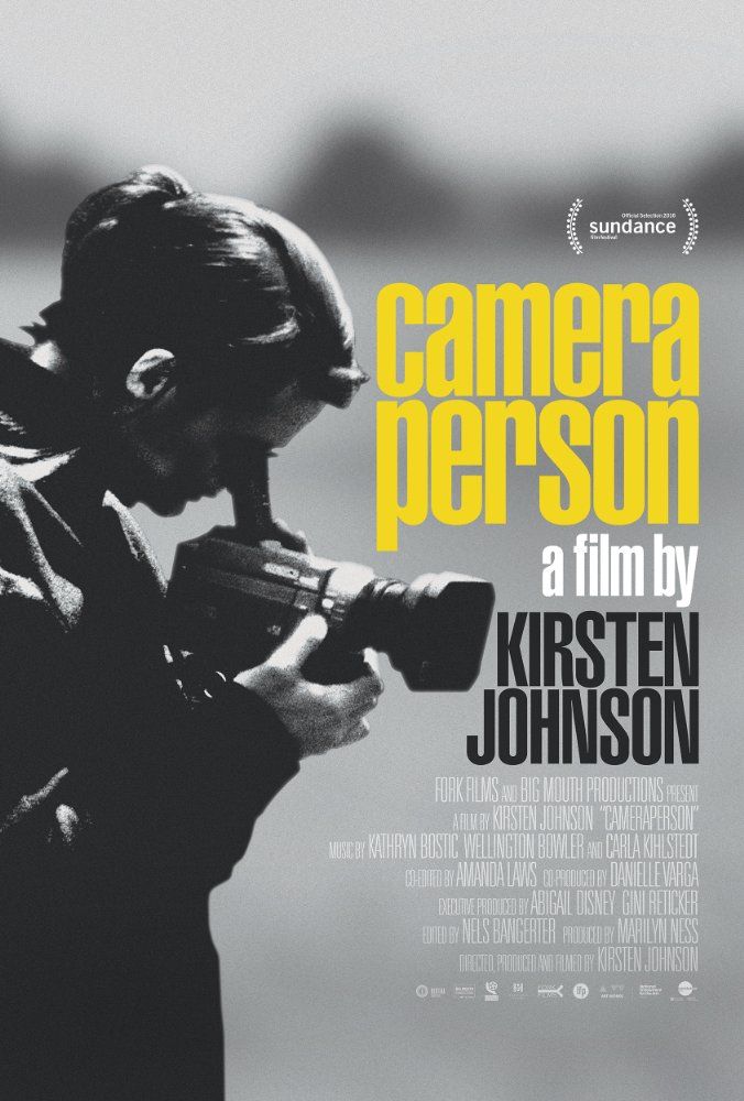 a movie poster with a man holding a camera in front of him and the words camera person on it