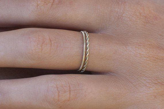 a woman's hand with a ring on it