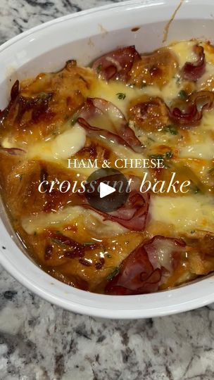 a casserole dish with ham and cheese in it on a marble counter top