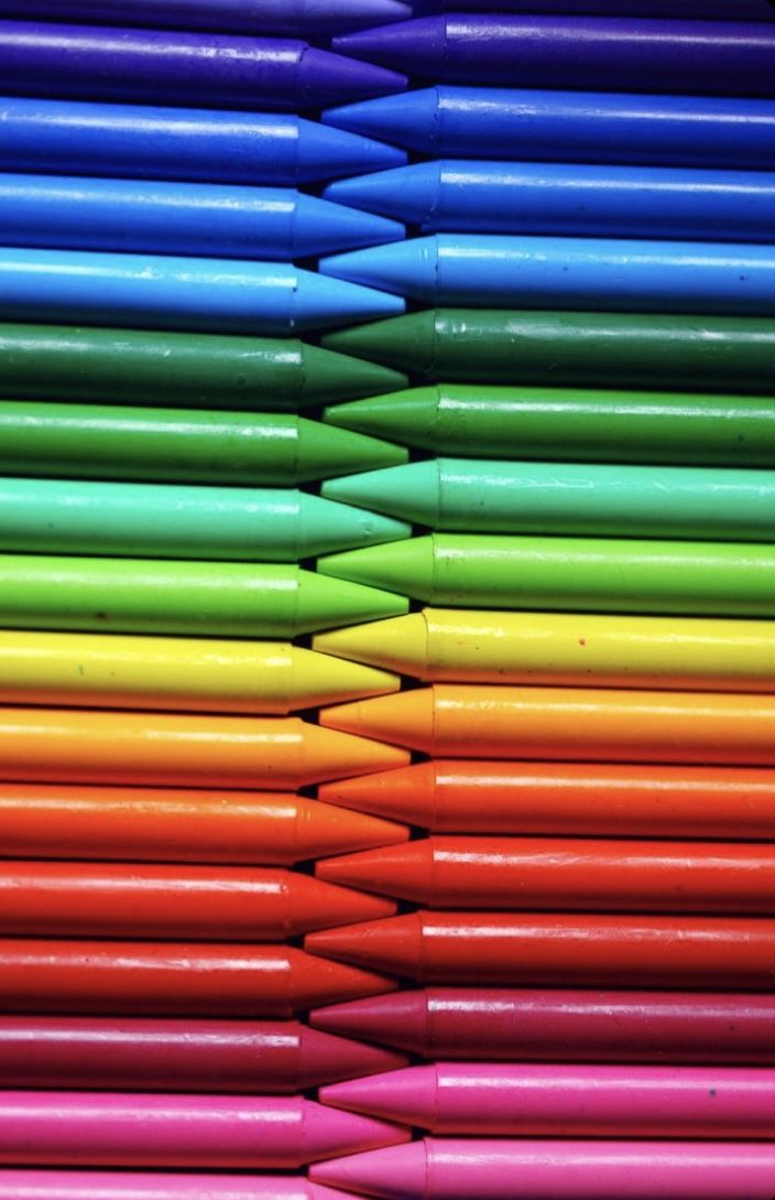 many different colored crayons stacked on top of each other in the same color