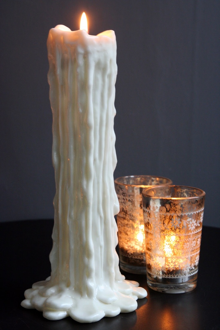 two candles sitting next to each other on a table