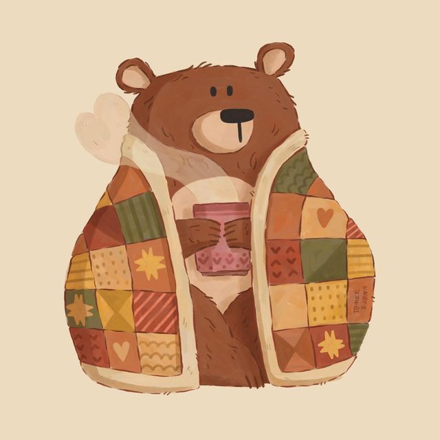 a brown bear holding a coffee cup in its paws and wearing a quilted coat