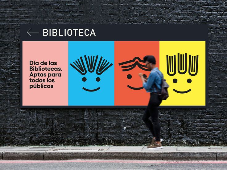 a woman walking past a sign that says bibliotea