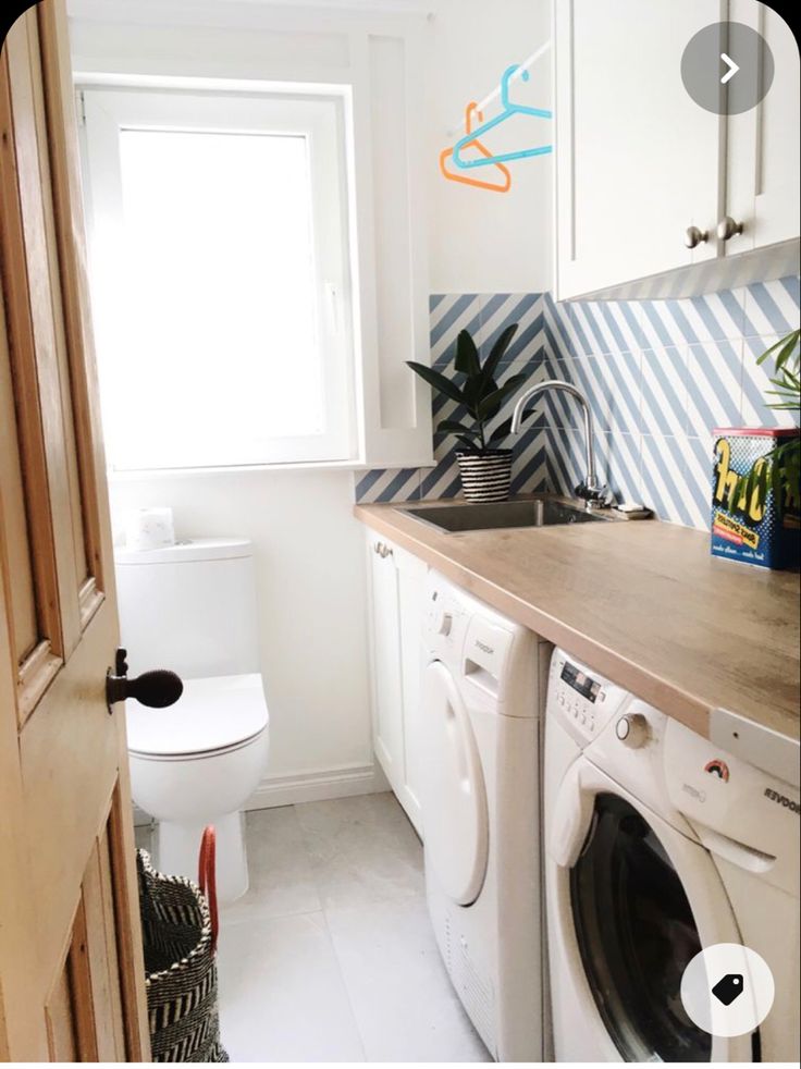 a washer and dryer in a small room