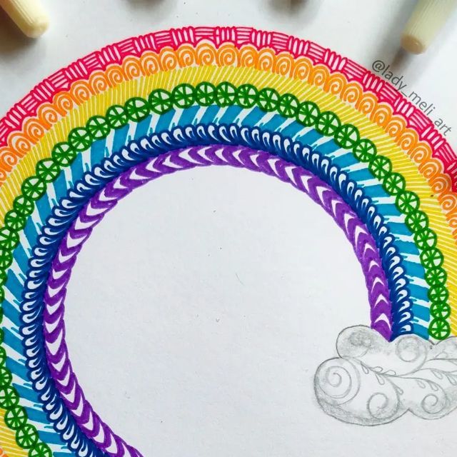 a rainbow colored drawing with crayons and markers