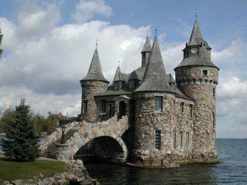 an old castle sitting on top of a body of water