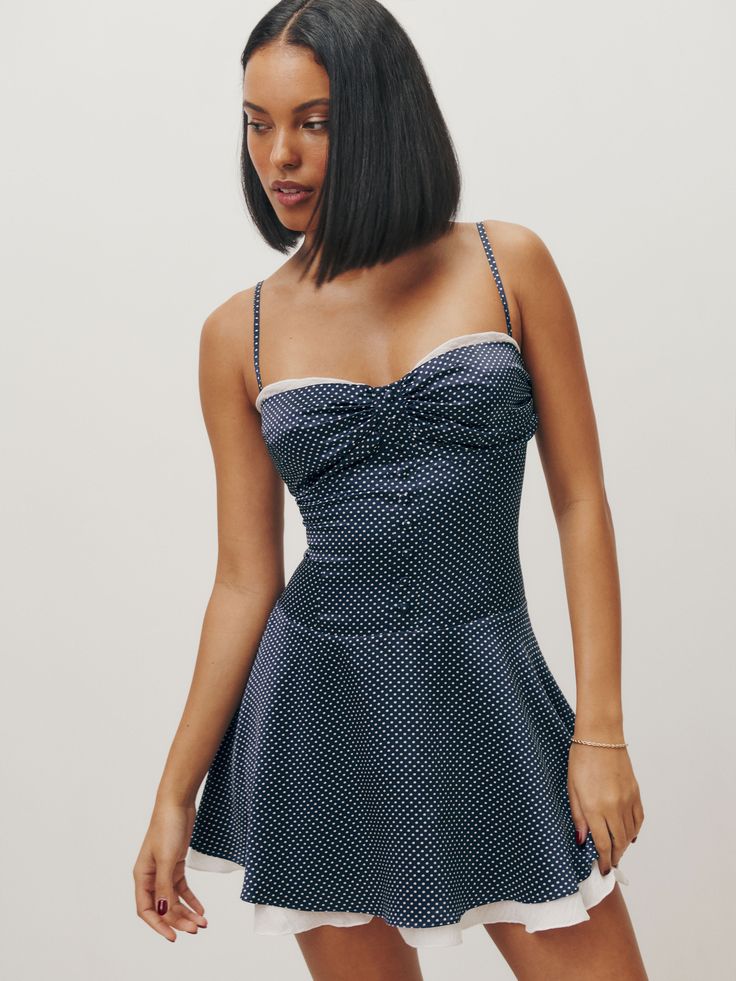 Who, me. Shop the Ursula Silk Dress from Reformation, a sleeveless mini dress with a sweetheart neckline, drop waist, and a button front. Silk Dress Reformation, Swimwear Dress, Vintage Inspired Dresses, Silk Charmeuse, European Summer, Clothing Essentials, A Button, Blue Silk, Inspired Dress