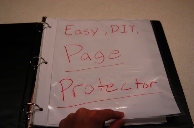 a hand writing on a piece of paper that says easy diy, page protector