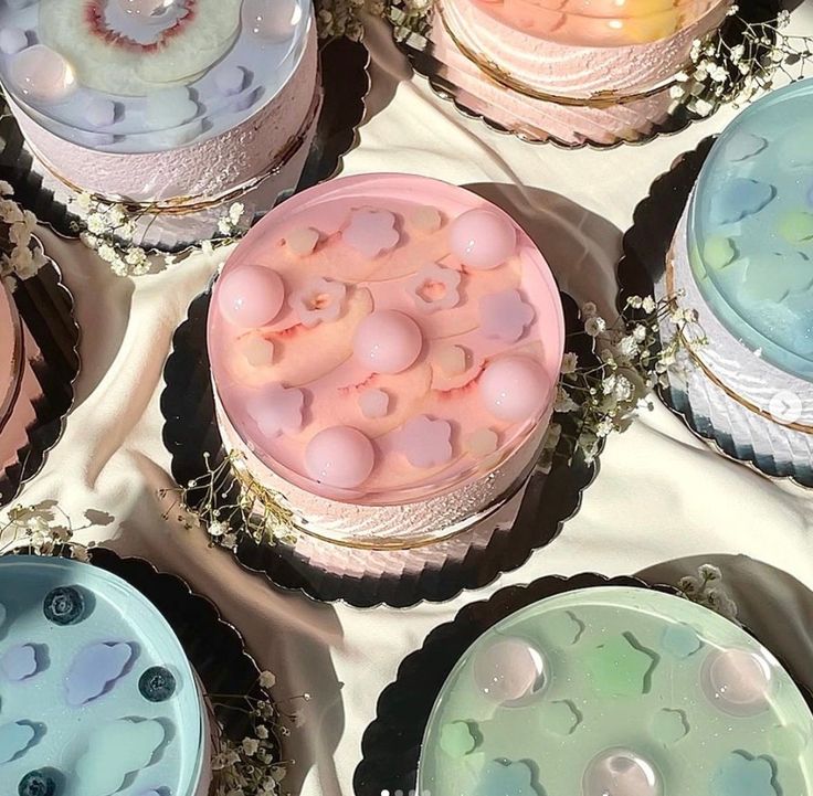 there are many cupcakes with different designs on them