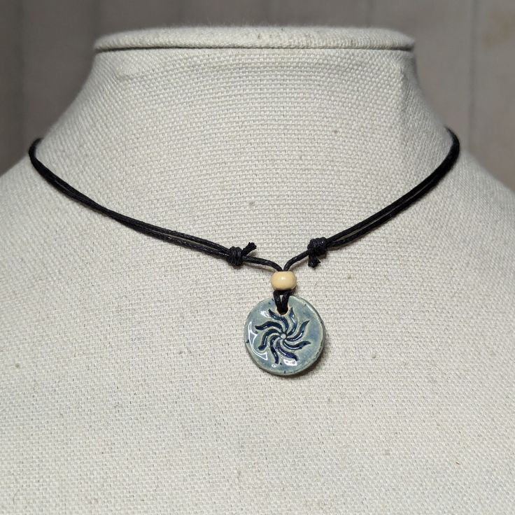 Light Blue Ceramic Pendant Handmade Spiral Swirl Sun Burst Charm Boho Gothic Whimsigoth Hippie Adjustable Black Rope Cord Choker Stacking Necklace Comes On An Adjustable Waxed Black Cord Necklace. Necklace Is Adjustable From Approximately 13" To 22". To Wear Your Necklace Pull The Two Knots Away From The Pendant To Adjust To A Larger Size, Leave About An Inch Of Space Between The Two Knots To Prevent It From Getting Stuck. Put Cord Around Your Neck And Pull The Two Knots In The Opposite Directio Green Clothes, Jump Ring Jewelry, Cord Choker, Sun Burst, Black Cord Necklace, Bedroom Setup, Stacked Necklaces, Rope Cord, Black Rope