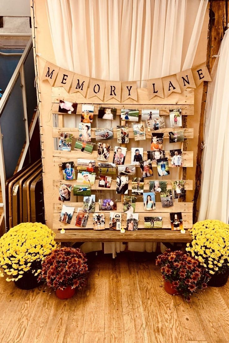 a memorial display with flowers and pictures on it