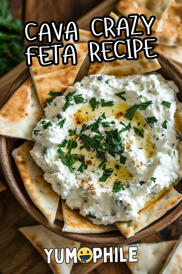 a bowl filled with white sauce and pita chips