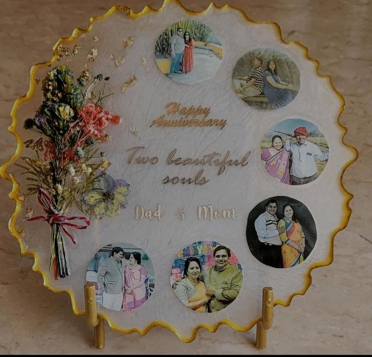 a plaque with many pictures on it that reads happy anniversary two beautiful sons dad and mom