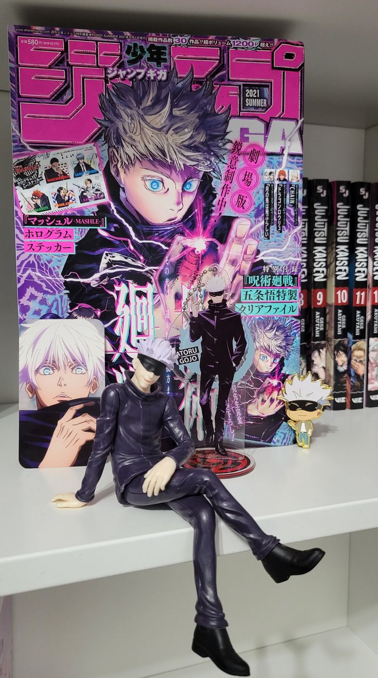 an anime figurine sitting on top of a table next to a book shelf