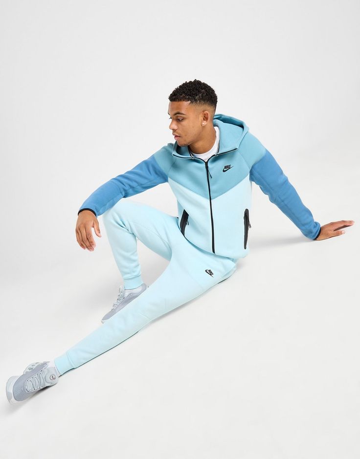 Whether you're kickin' back or heading out, do it in style and comfort with these men's Tech Fleece Joggers from Nike. In a Glacier Blue colourway, these slim, tapered joggers are cut from soft Tech Fleece fabric for everyday comfort. They feature an elasticated, drawcord waistband for an adjustable fit, with ribbed cuffs to hold the shape and side pockets and a zip-up pouch for storage. Finished up with signature Futura branding. Machine washable | Our model is 6'1" and wears a size medium. Blue Nike Joggers, Nike Tech Fleece Joggers, Liverpool Manchester United, Nike React Vision, 270 Nike, Tapered Joggers, Joggers Track Pants, Nike Joggers, Nike Tech Fleece