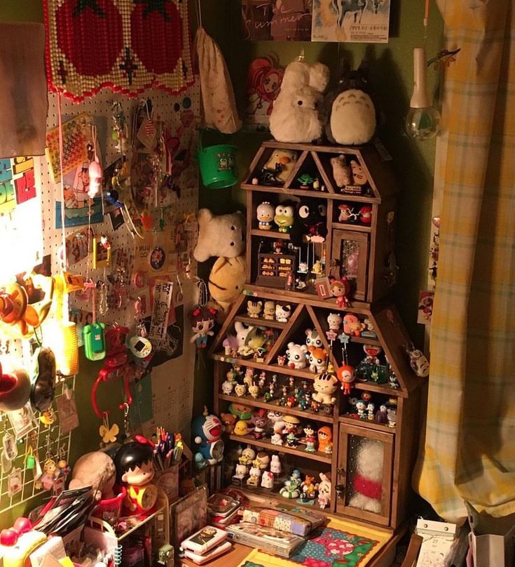 a room filled with lots of stuffed animals and other things on the wall next to a window