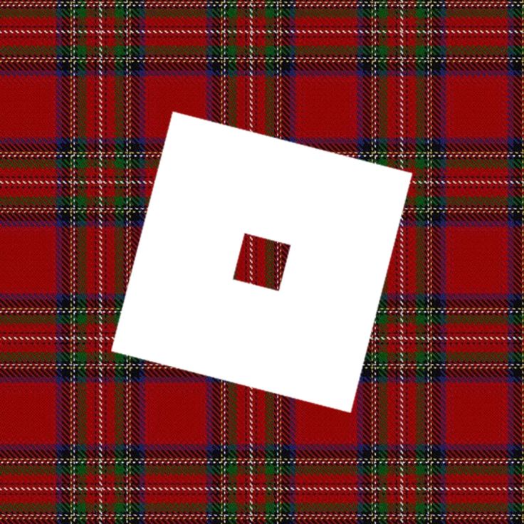 a red and green plaid with a white square in the center on top of it