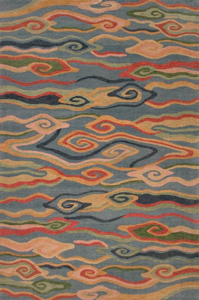 an area rug with multicolored waves on it