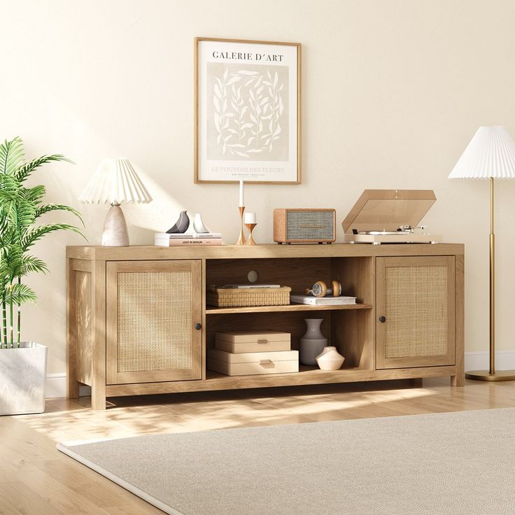 a living room scene with focus on the sideboard and lamp in the foreground