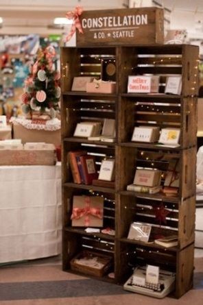 there is a book shelf that has many books on it and christmas decorations in the background