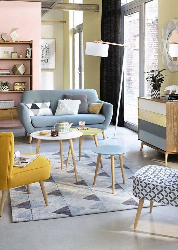 a living room filled with lots of furniture and decor on top of a carpeted floor