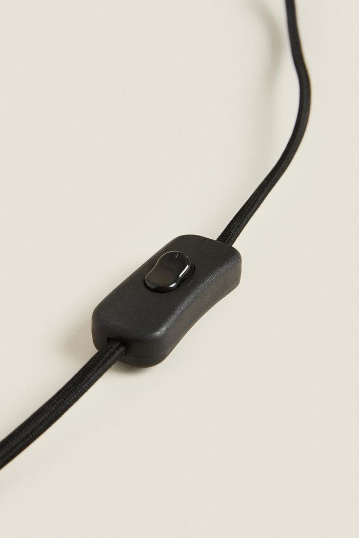 a black cord connected to an electronic device