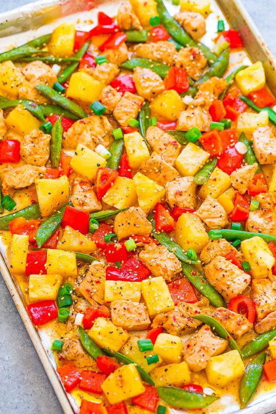 a sheet pan filled with chicken, peppers and green beans