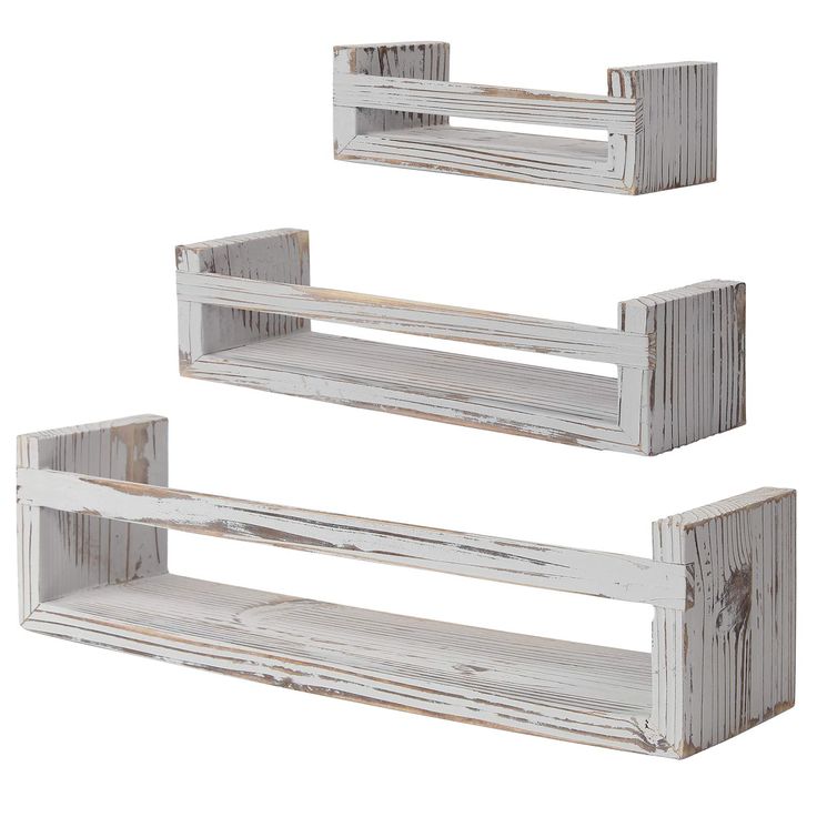 three white wooden shelves are stacked on top of each other