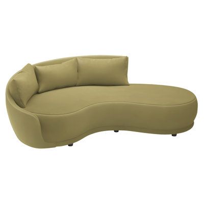 a curved couch with pillows on it