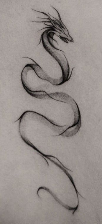 a black and white photo of a snake tattoo