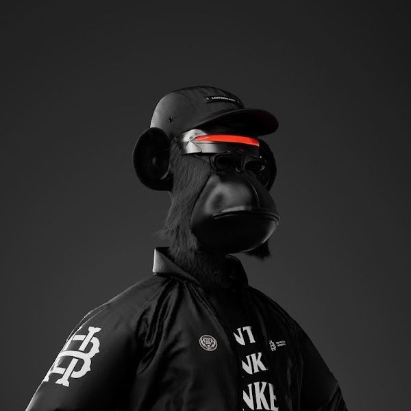 a monkey wearing a baseball cap and black shirt with white letters on it's face