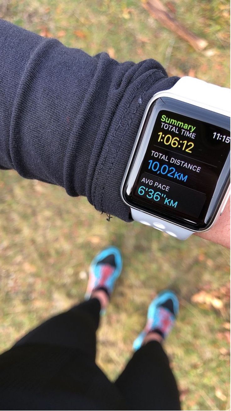 a person wearing a smart watch with the time displayed on it's wristband