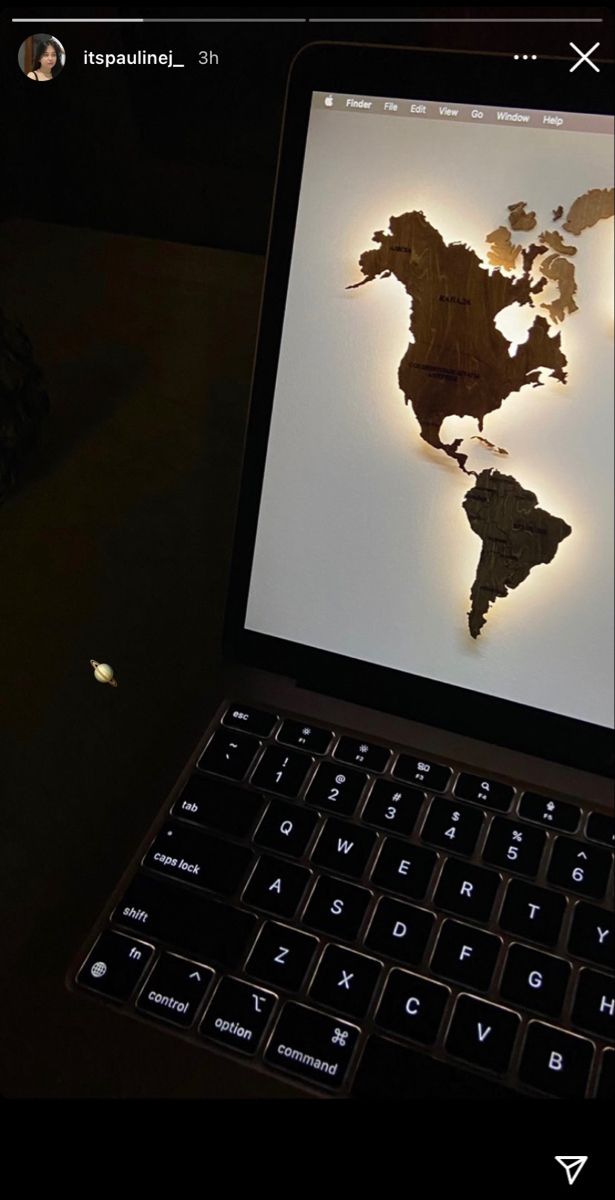 an open laptop computer sitting on top of a table