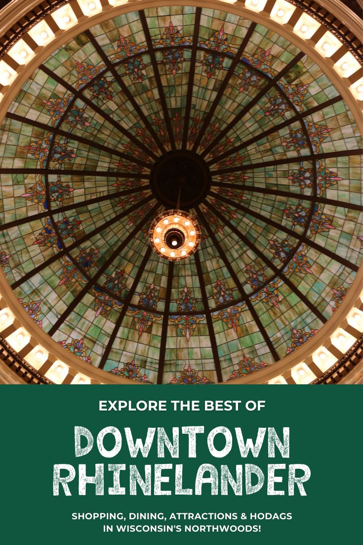 the inside of a building with a glass dome and lights on it's ceiling