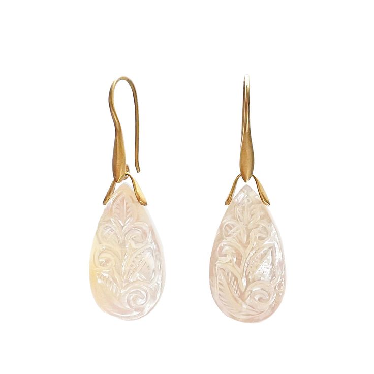 Gold, Pearl & Stone Earrings - Vines swirl and leaves unfurl in these pear-shapedcarved mother-of-pearl earrings, which will add a soft glow to any ensemble. Made in 18k yellow gold with a matte finish, they hang from 18k recycled gold ear wires. Engraved Earrings, Vine Leaves, Mother Of Pearl Jewelry, Mother Of Pearl Earrings, Gold Pearl Earrings, Recycled Gold, Gold Pearl, Stone Earrings, Mother Of Pearl