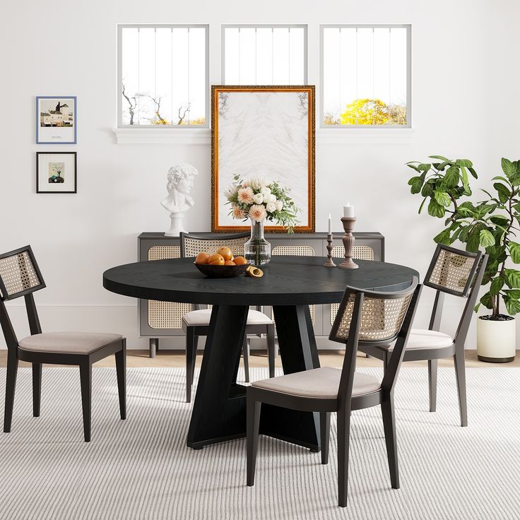 a black table with four chairs around it