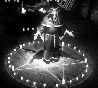 a person standing on top of a circle with candles in it