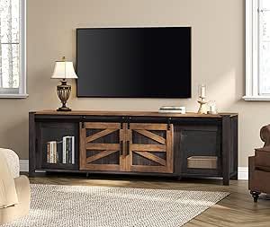 a large flat screen tv mounted to the side of a wooden entertainment center in a living room