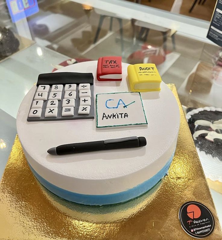 a cake with a calculator and some writing on it