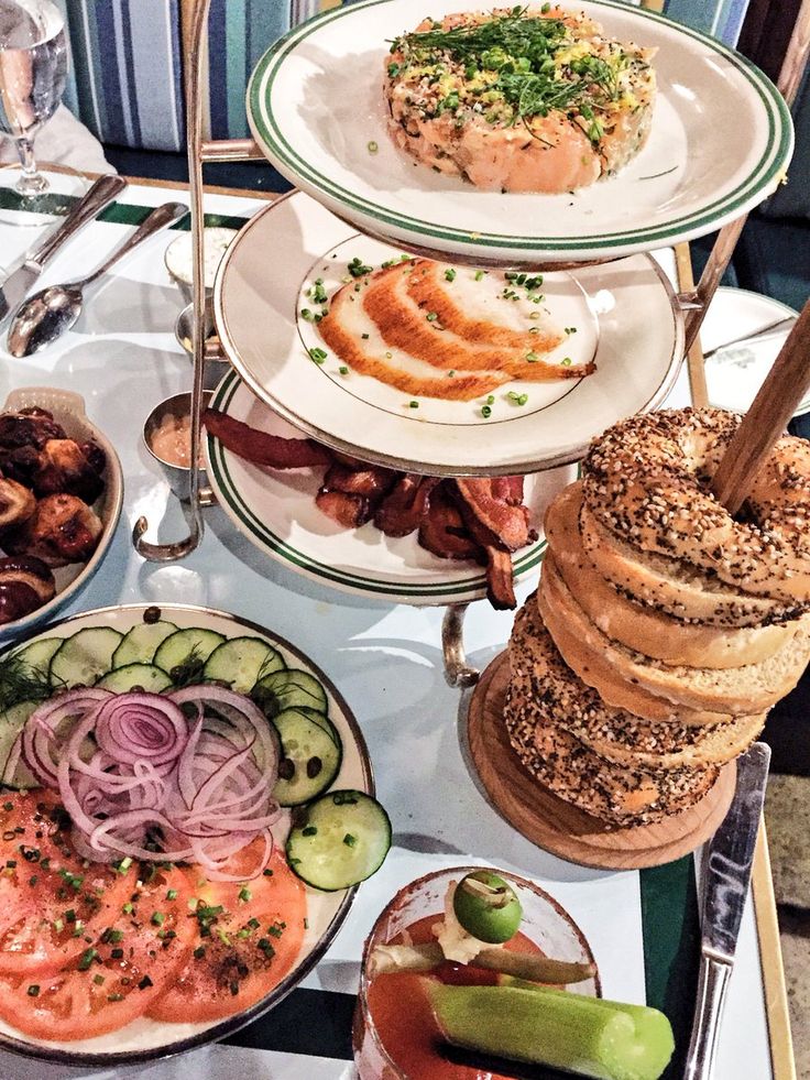 three tiered trays filled with different types of food