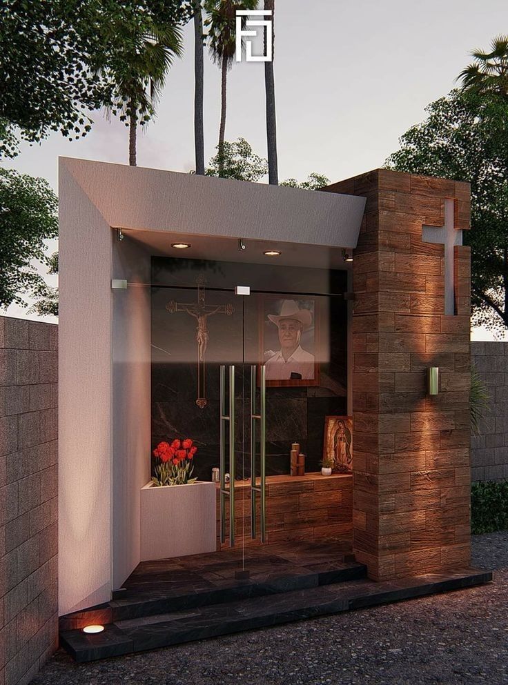 an entrance to a building with flowers in the window and palm trees behind it at sunset