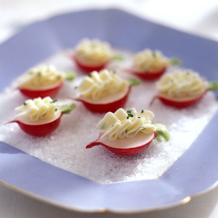 small appetizers are displayed on a blue plate